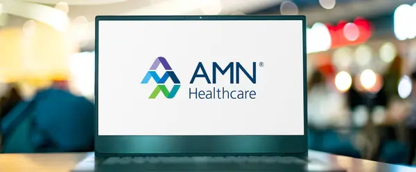 Stock image POZNAN, POL - MAR 8, 2023: Laptop computer displaying logo of AMN Healthcare Services, Inc.