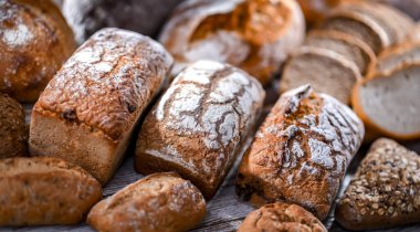 Assorted bakery products including loaves of bread and rolls