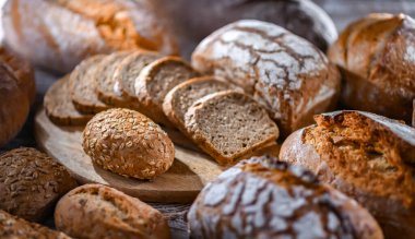Assorted bakery products including loaves of bread and rolls