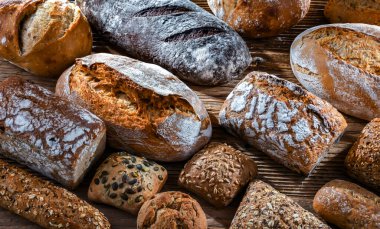 Assorted bakery products including loaves of bread and rolls