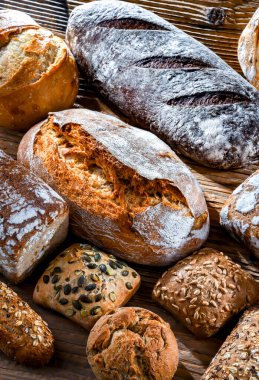 Assorted bakery products including loaves of bread and rolls