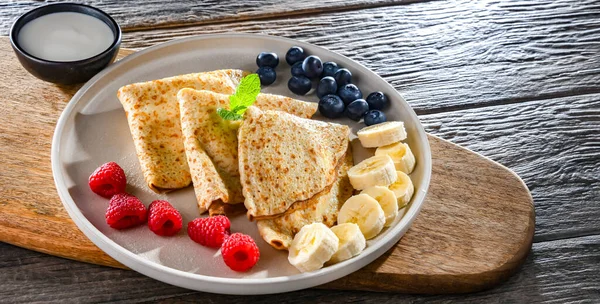 stock image A plate of home-made Polish pancakes filled with sweet cottage cheese