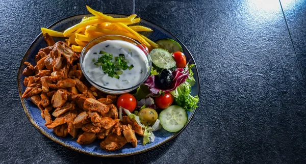 Kebab Served French Fries Vegetable Salad Tzatziki — Stok fotoğraf