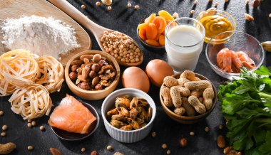 Composition with common food allergens including egg, milk, soya, nuts, fish, seafood, wheat flour, mustard, dried apricots and celery clipart