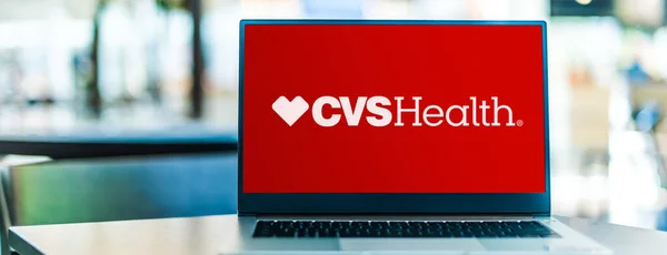 stock image POZNAN, POL - JUN 28, 2022: Laptop computer displaying logo of CVS Health Corporation, an American healthcare company that owns CVS Pharmacy, a retail pharmacy chain