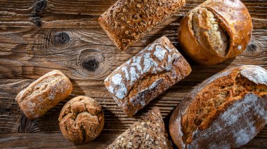 Assorted bakery products including loaves of bread and rolls