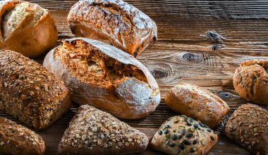 Assorted bakery products including loaves of bread and rolls