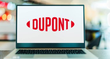 POZNAN, POL - DEC 28, 2022: Laptop computer displaying logo of DuPont, a chemical company based in Wilmington, Delaware, USA