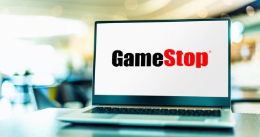 POZNAN, POL - NOV 22, 2022: Laptop computer displaying logo of GameStop, an American video game, consumer electronics, and gaming merchandise retailer