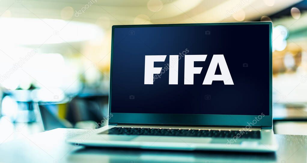 POZNAN, POL - NOV 22, 2022: Laptop computer displaying logo of FIFA, an international governing body of association football, beach football and futsal