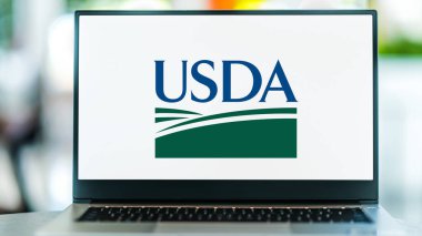 POZNAN, POL - MAY 1, 2021: Laptop computer displaying logo of USDA, the federal executive department responsible for developing and executing federal laws related to farming, forestry and food clipart