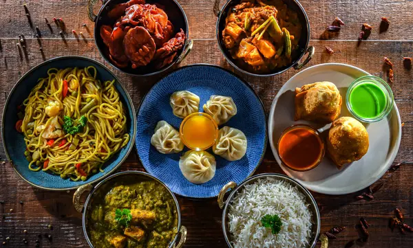 stock image Composition with indian dishes: samosa, pakora, palak paneer, jalfrezi, thukpa and naan bread