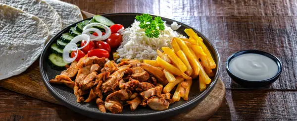 Kebab Served Rice French Fries Pitta Bread Vegetables Tzatziki — Stock Photo, Image