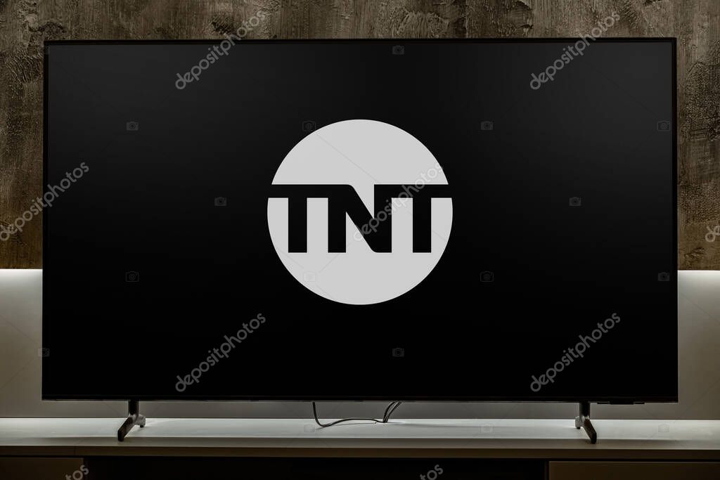 POZNAN, POL - DEC 19, 2023: Flat-screen TV set displaying logo of TNT, an American basic cable television channel owned by WarnerMedia Studios & Networks