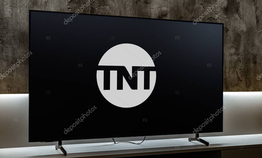 POZNAN, POL - DEC 19, 2023: Flat-screen TV set displaying logo of TNT, an American basic cable television channel owned by WarnerMedia Studios & Networks