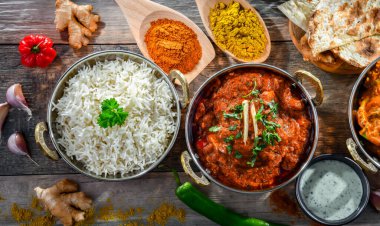 Hot madras paneer and vegetable masala with basmati rice served in original indian karahi pots.