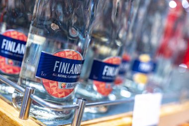 DUBAI, UAE - MAR 22, 2022: Bottles of Finlandia Grapefruit vodka on a store shelf clipart