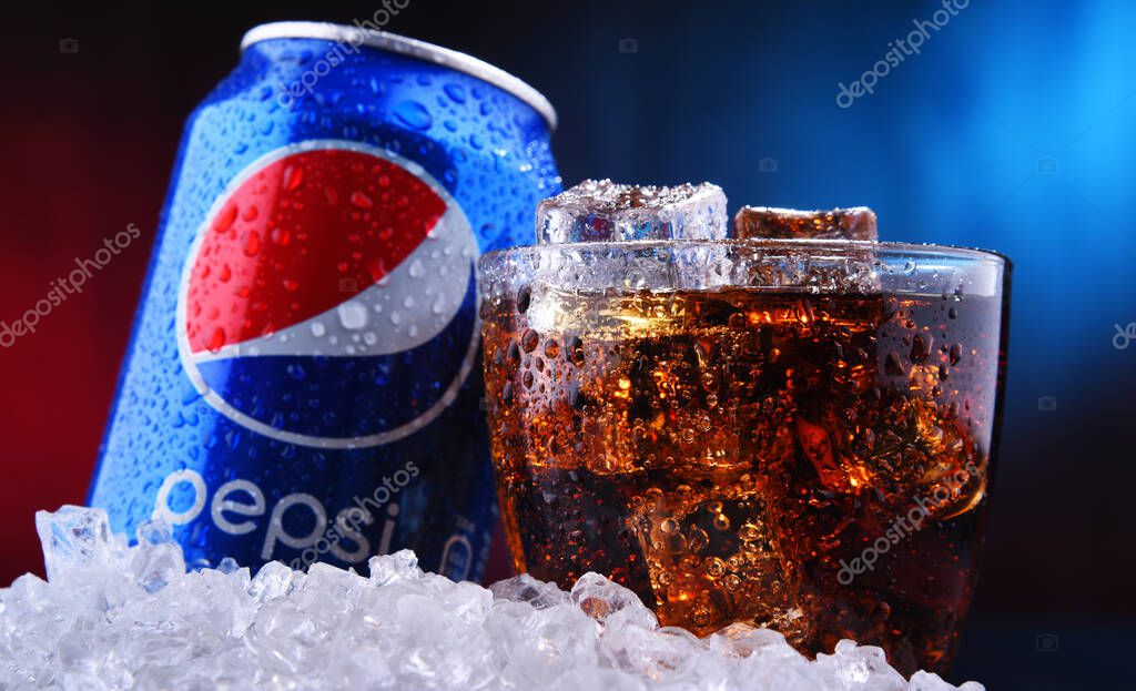 POZNAN, POL - AUG 13, 2019: A can and a glass of Pepsi, a carbonated soft drink produced and manufactured by PepsiCo. The beverage was created and developed in 1893 under the name Brad's Drink