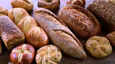 Assorted bakery products including loaves of bread and rolls