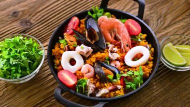 Seafood paella served in a cast iron pan