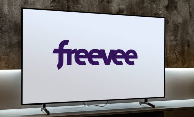 POZNAN, POL - JUL 31, 2024: Flat-screen TV set displaying logo of Amazon Freevee, an American ad-supported video-on-demand (VOD) streaming service owned by Amazon clipart