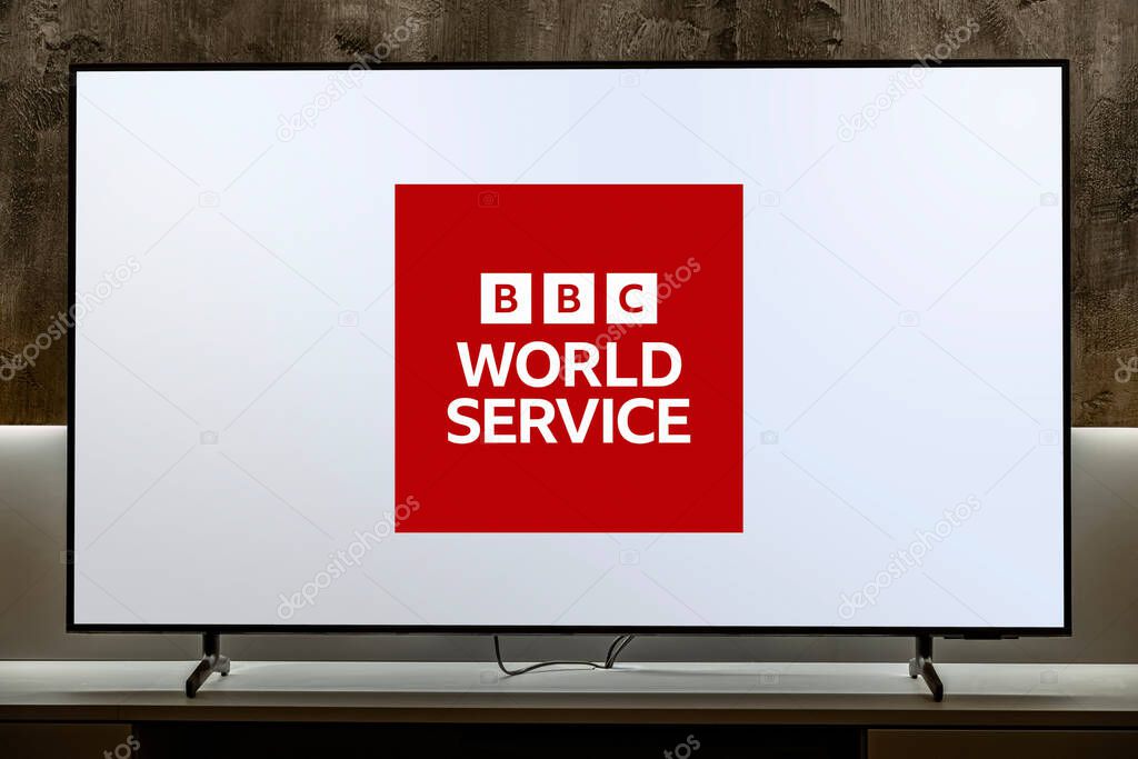 POZNAN, POL - JUL 31, 2024: Flat-screen TV set displaying logo of BBC World Service,  an international broadcaster owned and operated by the BBC