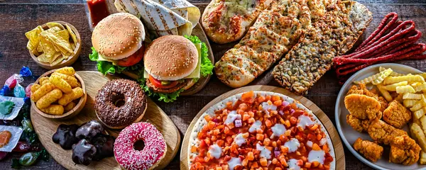 stock image Foods enhancing the risk of cancer. Junk food.