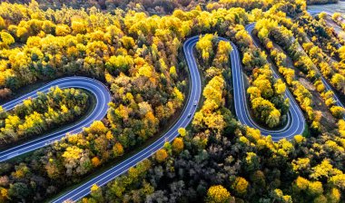 Serpentine road in Slonne Mountains near Sanok in Bieszczady Poland clipart