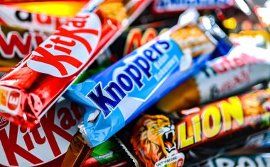 POZNAN, POL - NOV 20, 2024: Variety of popular brands of confectionery products clipart