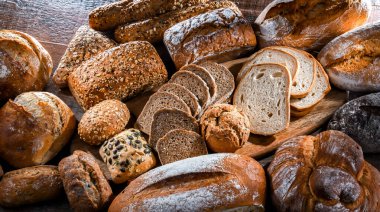 Assorted bakery products including loaves of bread and rolls