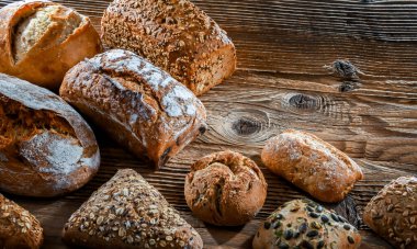 Assorted bakery products including loaves of bread and rolls