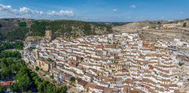 Panoramic aerial view of Alcala del Jucar province of Albacete listed as beautiful villages of Spain clipart