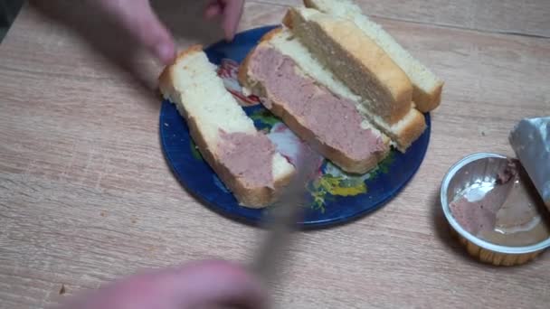 Man Puts Pate Knife Slice Bread — Stock Video