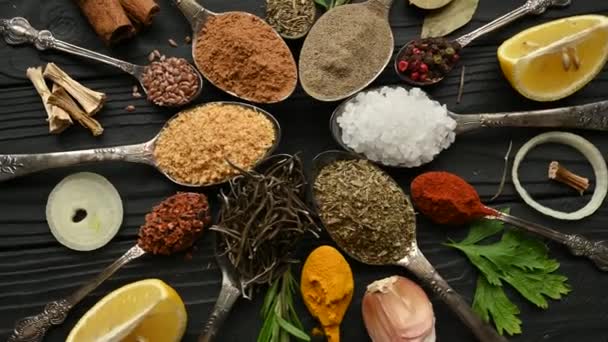 Colorful Herbs Spices Cooking Indian Spices Black Background Top View — Stock Video