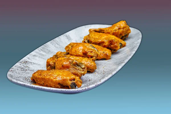 Composition Plate Chicken Wings Buffalo Sauce Magenta Light Blue Background — Stock Photo, Image