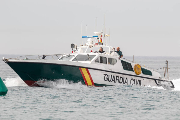 TORRE DEL MAR, MALAGA, SPAIN-JUL 12: Guardia Civil coast guard patrol taking part in a exhibition on the 4th airshow of Torre del Mar on July 12, 2019, in Torre del Mar, Malaga, Spain