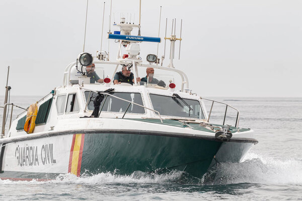 TORRE DEL MAR, MALAGA, SPAIN-JUL 12: Guardia Civil coast guard patrol taking part in a exhibition on the 4th airshow of Torre del Mar on July 12, 2019, in Torre del Mar, Malaga, Spain