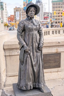 Ottawa, Ontario - October 19, 2022: The Valiants Memorial in Ottawa which commemorates fourteen figures from military history of Canada, here Laura Secord. clipart
