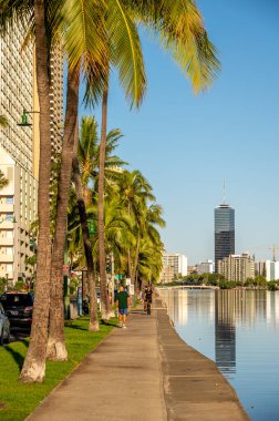 Honolulu, Hawaii - December 26, 2022: Views along the Ala Wai Canal that surrounds the Honolulu neighbourhood of Waikiki.