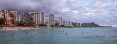 Honolulu, Hawaii - December 29, 2022: View of Waikiki Beach with Diamond Head valcano in the distance.