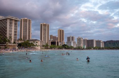 Honolulu, Hawaii - December 29, 2022: View of Waikiki Beach with Diamond Head valcano in the distance.