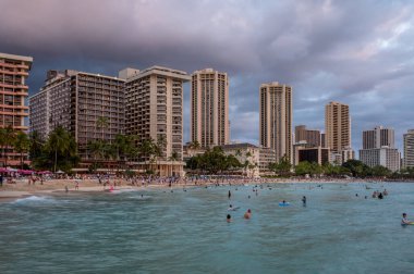Honolulu, Hawaii - December 29, 2022: View of Waikiki Beach with Diamond Head valcano in the distance.