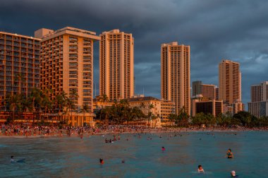 Honolulu, Hawaii - December 29, 2022: View of Waikiki Beach with Diamond Head valcano in the distance.