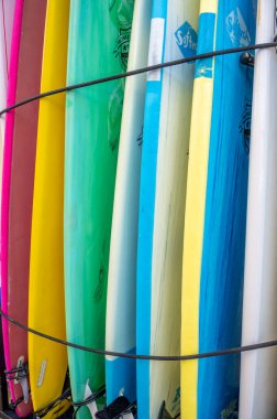 Honolulu, Hawaii - January 1, 2023: Surfboards lined up in storage in Waikiki.