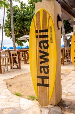 Honolulu, Hawaii - January 1, 2023: Surfboard signs at the Waikiki Beach Bistro in Waikiki.