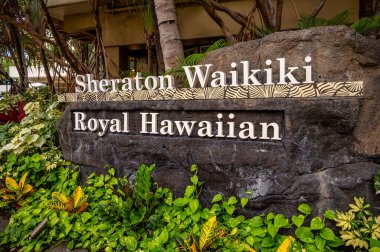 Honolulu, Hawaii - January 1, 2022: Entrance Sigh for the Sheraton Waikiki and Royal Hawaiian hotels.