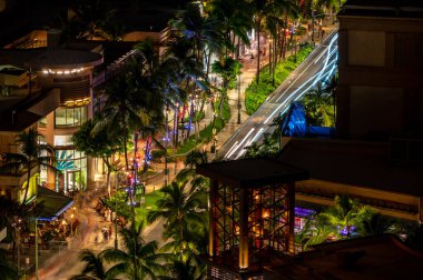 Kalakaua Avenue at night lfrom a high angled view.