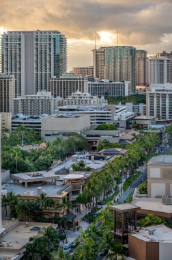 Honolulu, Hawaii - December 26, 2022: View looking down on Kalakaua Avenue in Waikiki during the evening.
