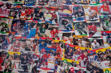 Calgary, Alberta - January 12, 2023: Vintage national hockey league player hockey trading cards. clipart
