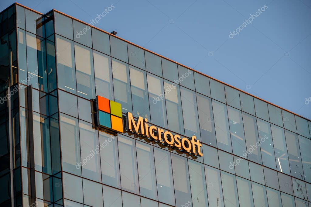 Vancouver, British Columbia - May 25, 2023: Microsoft logo on the side of a office building at sunset.